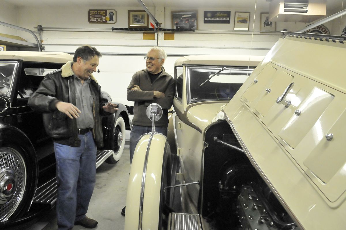 Car enthusiasts Gary Graupner, left, and Skip Ritner laugh about their auto adventures while standing among Ritner’s Packards in Ritner’s garage Saturday. Graupner is a Packard owner, too. Ritner has produced specialty parts for Packards for the past 26 years. (Jesse Tinsley / JESSE TINSLEY/The Spokesman-Review)