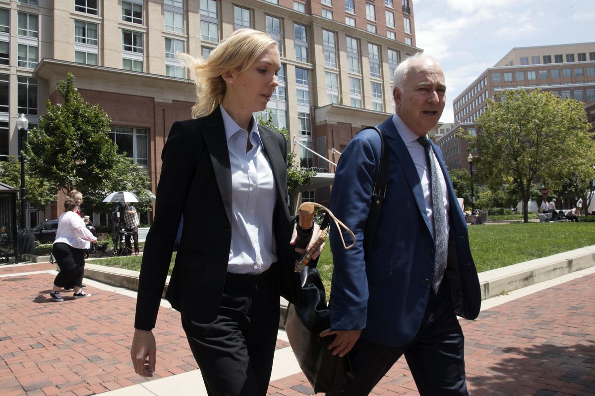 Paul Manafort’s former bookkeeper Heather Washkuhn, left, walks to the Alexandria Federal Courthouse in Alexandria, Va., on Thursday, Aug. 2, 2018, to testify at President Donald Trump’s former campaign chairman Manafort’s tax evasion and bank fraud trial. Washkuhn testified that Manafort kept her in the dark about the foreign bank accounts he was using to buy millions in luxury items and personal expenses. (Manuel Balce Ceneta / AP)