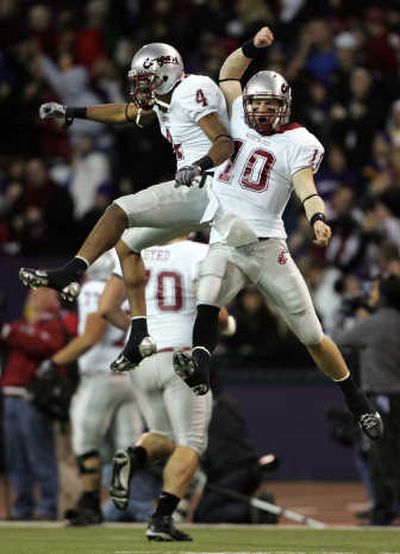 
Brandon Gibson, left, celebrates with Alex Brink after Brink threw a 41-yard TD to Devin Frischknecht in first quarter. Associated Press
 (Associated Press / The Spokesman-Review)