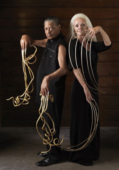 ORG XMIT: UTEW101 This undated image provided by the Guiness World Records Book launch shows Lee Redmond, right, former record holder for longest fingernails (28-ft 4-in), posing with with Melvin Booth, the male owner of the longest finger nails (29-ft 8-in). This photo was taken just a few months prior to Redmond's accident which resulted in the loss of her fingernails, for the 2010 Edition of Guinness World Records.(AP Photo/Guiness World Records Book Launch, Ronald Mackechnie) ** NO SALES MANDATORY CREDIT NO ARCHIVE ** (Ranald Mackechnie / The Spokesman-Review)