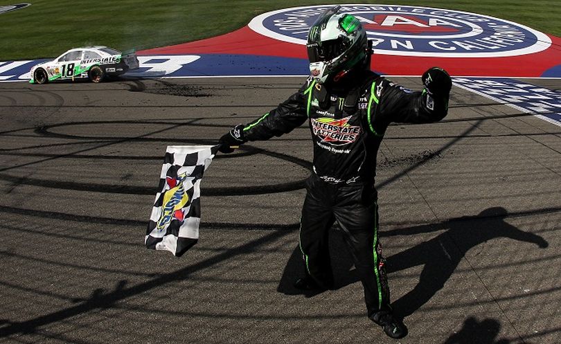 Kyle Busch, driver of the #18 Interstate Batteries Toyota, celebrates after winning the NASCAR Sprint Cup Series Auto Club 400 at Auto Club Speedway on March 24, 2013 in Fontana, California. (Photo by Todd Warshaw/NASCAR via Getty Images)  (Tom Pennington / Nascar)