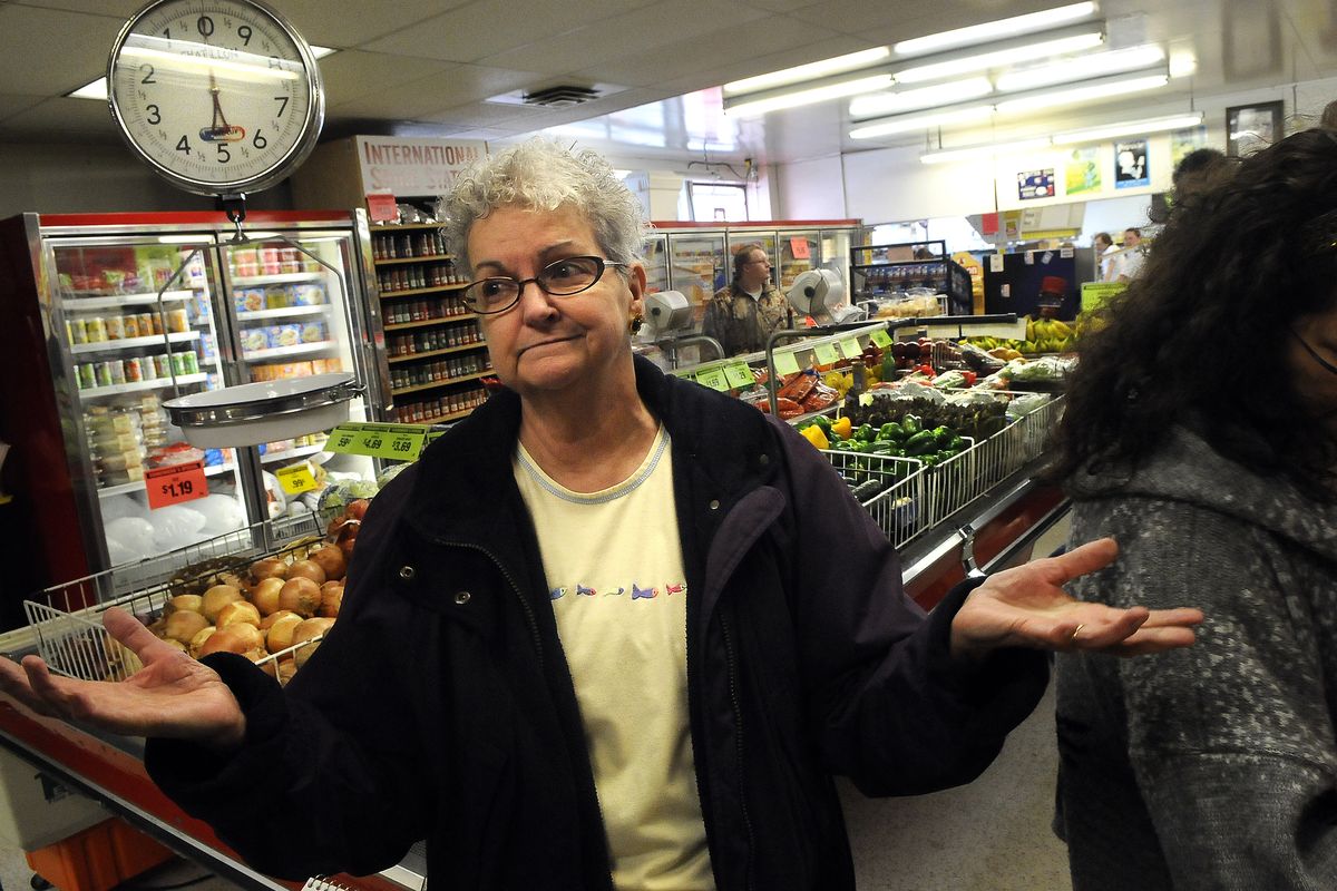 Donna Sampson purchases in bulk with her monthly Social Security check at Sonnenberg’s Market at 1528 E. Sprague Ave. (Dan Pelle)