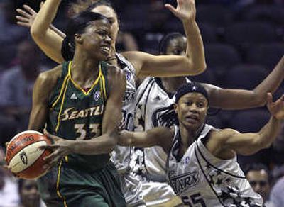 
San Antonio Silver Stars' Ruth Riley, background, and Vickie Johnson, right, defend Seattle Storm's Janell Burse in the first half. Associated Press
 (Associated Press / The Spokesman-Review)