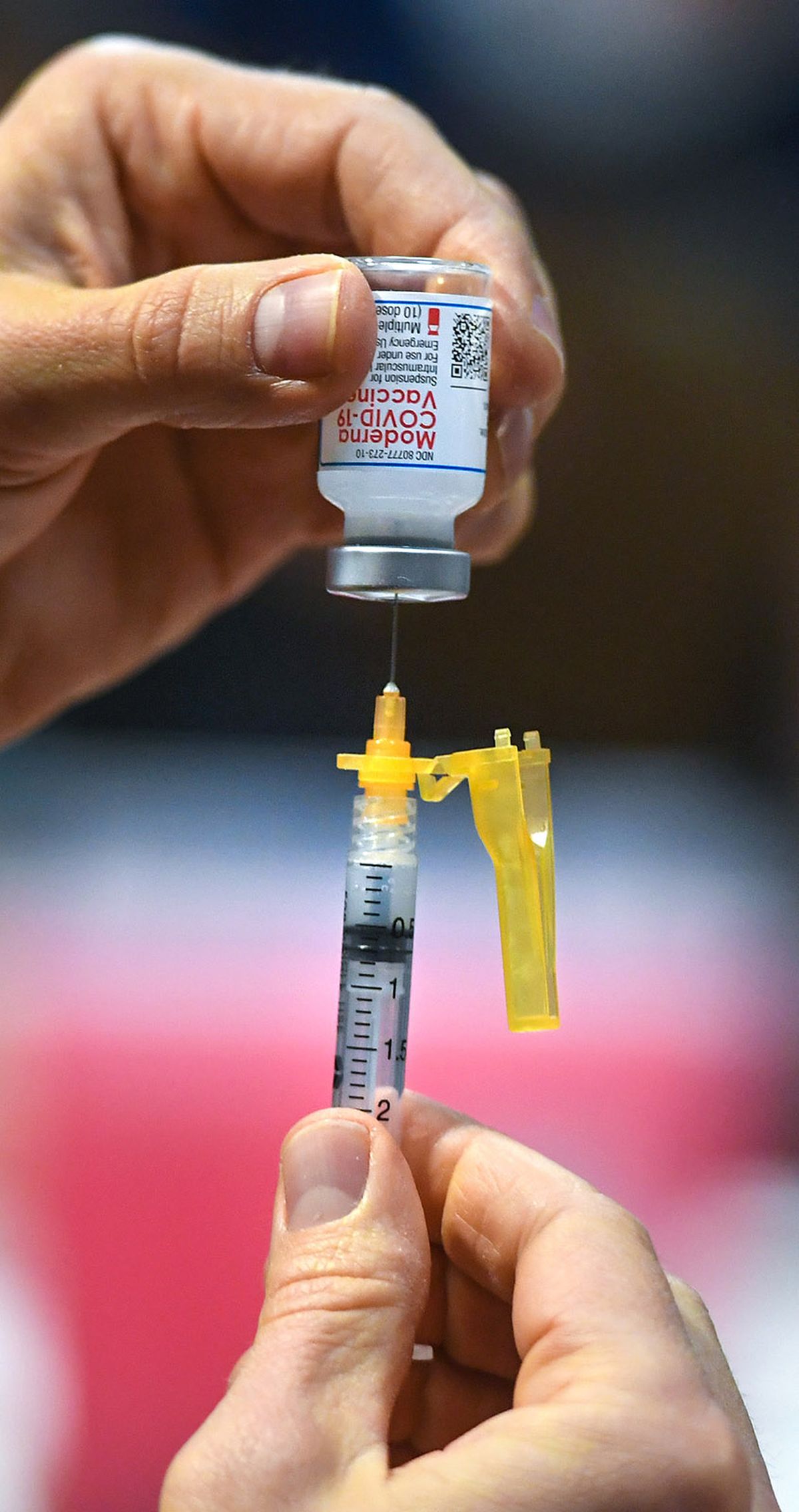 WSU nursing student Dane Lawson loads up another dose of Moderna COVID-19 vaccine during a Spokane Regional Health District vaccine clinic, Tuesday, March 2, 2021, at the House of Charity in downtown Spokane. (DAN PELLE/THE SPOKESMAN-REVIEW)