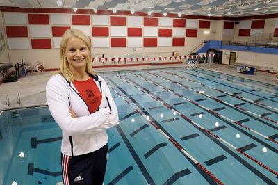 Jeni McNeal, an associate professor of exercise science at Eastern Washington University, stands above the pool at EWU. McNeal has been the director of physical preparedness for the U.S. Olympic Diving Team for the past six years. (Jesse Tinsley / The Spokesman-Review)