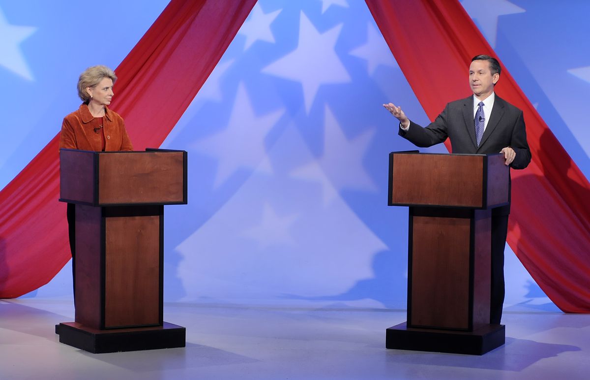Gov. Chris Gregoire and challenger Dino Rossi make opening statements at a debate in Spokane on Thursday.   (Jesse Tinsley / The Spokesman-Review)