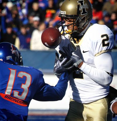 Boise State's Brandyn Thompson (13) causes Idaho's Maurice Shaw (2) to fumble during the first half of an NCAA college football game on Saturday, Nov. 14, 2009 in Boise, Idaho. Boise State recovered the ball. (Associated Press /  )
