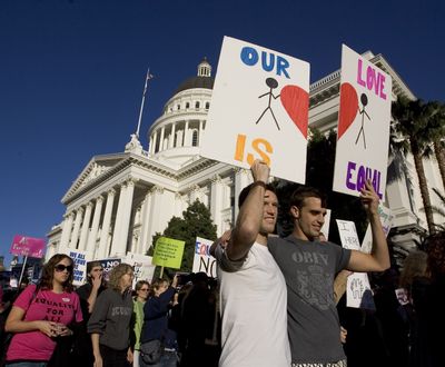 Anders Bollingmo, second from right, and Daniel Powell, both of San Francisco, march at the state Capitol  in Sacramento, Calif., on Sunday. The pair were among about 2,500 people protesting  the passage of Proposition 8.  (Associated Press / The Spokesman-Review)