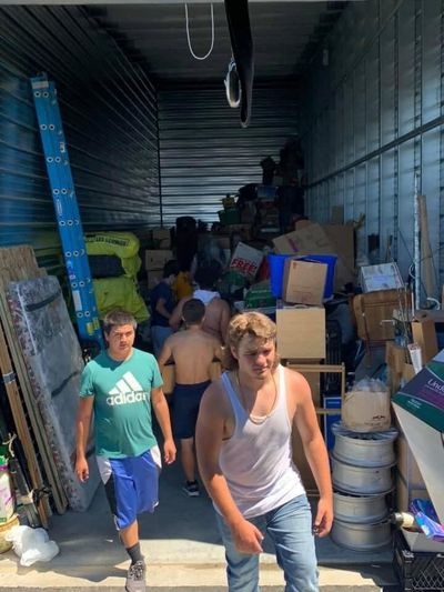 The Rogers High School football team helped a woman move her items from a storage unit on June 28 in triple-digit heat. (Courtesy Matt Miethe)