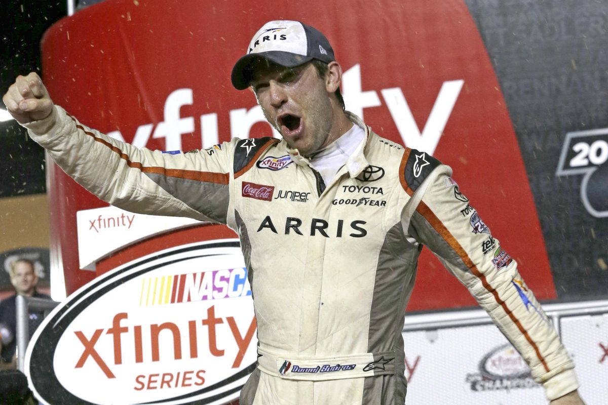 Daniel Suarez celebrates after wining the NASCAR Xfinity auto race and season title, Saturday, Nov. 19, 2016, in Homestead, Fla. (Terry Renna / Associated Press)