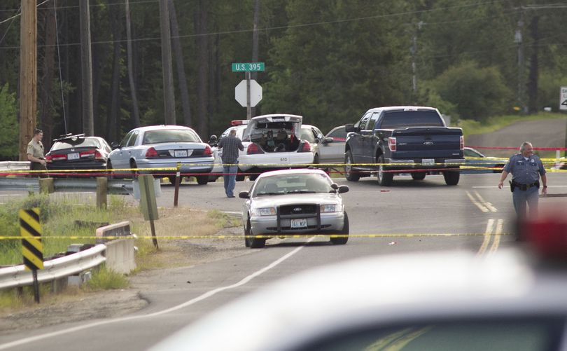 As police closed in on a suspect in the shooting of two Spokane County sheriff's deputies, Tuesday, June 19, 2012, the suspect fired repeatedly at pursuing cars, then shot himself in Deer Park at U.S. Highway 395 and Crawford Road. (The Spokesman-Review)
