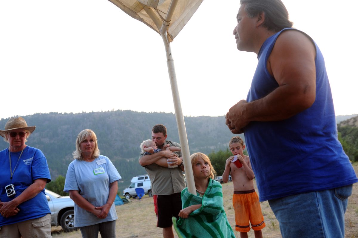 Bill Matt Sr., a conservation officer with the tribe, says a prayer before Sunday’s meal at the Blue Creek campground on the Spokane Indian Reservation. (Rajah Bose / The Spokesman-Review)