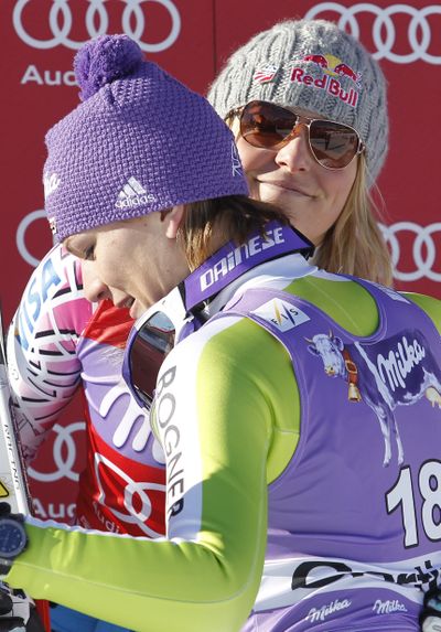 Maria Riesch of Germany, front, and American Lindsey Vonn take their friendship and rivalry into the finals. (Associated Press)
