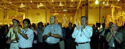 
Workers at NASA's Michoud Assembly Facility in New Orleans welcome the announcement of a contract earlier this month. Associated Press
 (Associated Press / The Spokesman-Review)