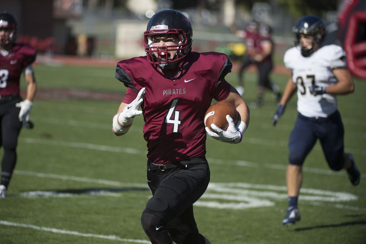 Whitworth receiver Michael McKeown (4) races for a 65-yard touchdown. (Tyler Tjomsland / The Spokesman-Review)