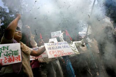 
Members of the Communist Party of India (Marxist Leninist) New Democracy burn an effigy of Prime Minister Manmohan Singh during a protest Thursday in New Delhi. Associated Press
 (Associated Press / The Spokesman-Review)