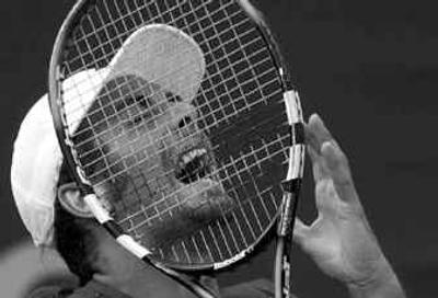 
Nicolas Massu agonizes during his five-set loss to Sargis Sargsian, which lasted over five hours. 
 (Associated Press / The Spokesman-Review)