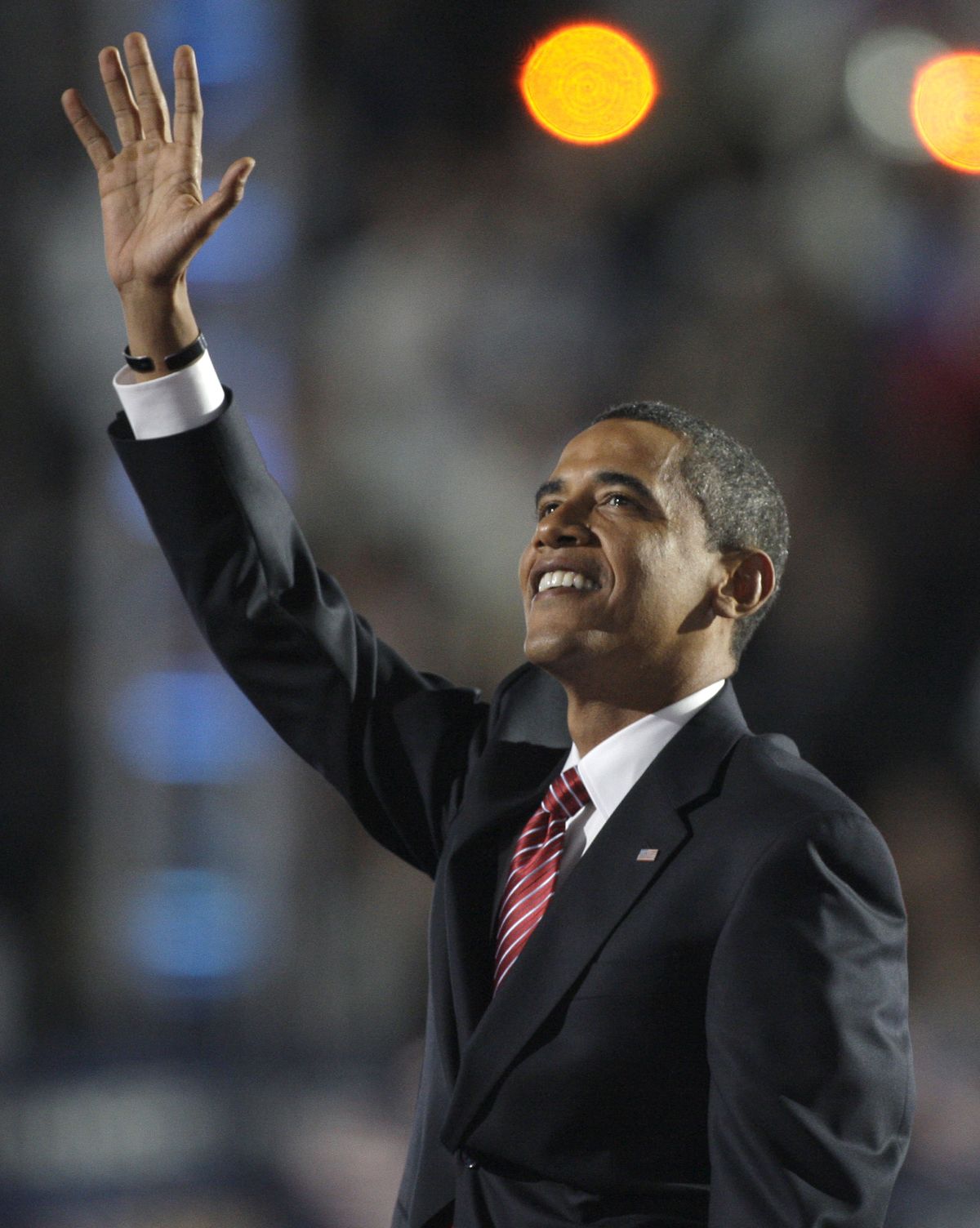 Democratic presidential candidate, Sen. Barack Obama, D-Ill., waves to a capacity crowd as he prepares to address the Democratic National Convention at Invesco Field in Denver on Thursday.  (Associated Press / The Spokesman-Review)