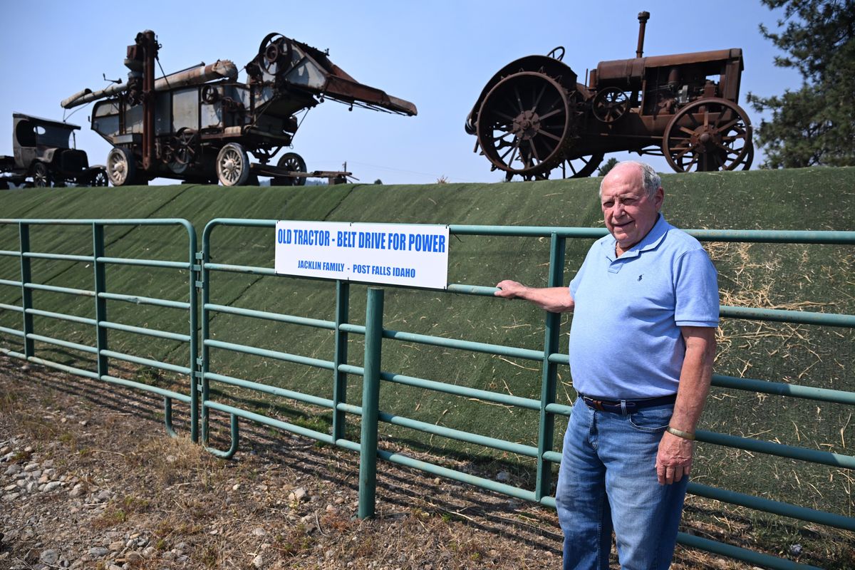 Don Jacklin, part of a longtime farming family in North Idaho, stands along a berm the runs along Highway 53 and Church Road in the Rathdrum, Idaho on which he has lined up antique farm equipment he has collected. Jacklin has collected the pieces, made signs explaining their purpose and lined them up along the highway. Photographed Wednesday, Sept. 3, 2025.  (Jesse Tinsley/THE SPOKESMAN-REVIEW)