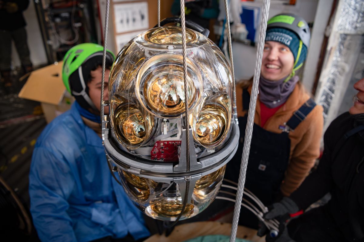 A long optical module with 18 photomultiplier tubes is prepared for installation at IceCube. MUST CREDIT: Yuya Makino/IceCube/National Science Foundation  (Yuya Makino/IceCube/NSF)