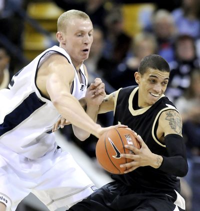 Idaho guard Steffan Johnson, right, in a game at Utah State in 2010, played just one season in Moscow after being expelled from the University of the Pacific. (Eli Lucero / Associated Press)