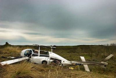 
A helicopter being used for a state fish and wildlife study  crashed on the Miller ranch   southeast of Sprague, Wash., on Friday morning. All three men on board walked away unharmed after the pilot made a crash landing.
 (Kathryn Stevens / The Spokesman-Review)