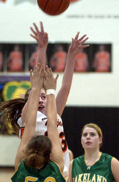 
Post Falls sophomore Jenny McVeigh shoots over Lakeland's Bridgitt Bohannon during Thursday's game. 
 (Tom Davenport/ / The Spokesman-Review)