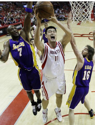 Lakers Lamar Odom, left, and Pau Gasol defend Houston’s Yao Ming.  (Associated Press / The Spokesman-Review)