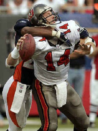 
Denver's Willie Middlebrooks sacked Tampa Bay quarterback Brad Johnson (14) last week, further revealing how far the Bucs have fallen in two years since reaching the Super Bowl.
 (Associated Press / The Spokesman-Review)