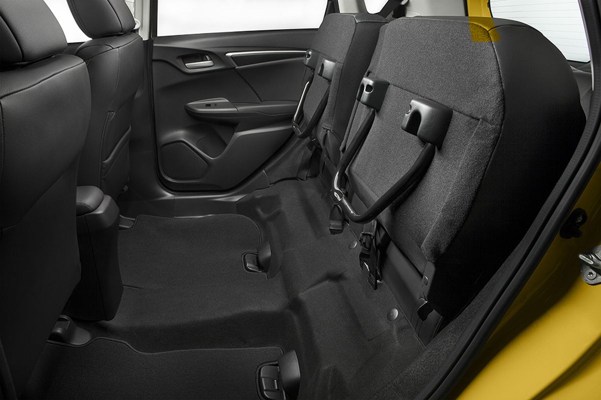 Tipping up the rear seats’ bottom cushions creates a well behind the front seats deep and wide enough to hold a bicycle, a pair of tall plants or a flat screen TV. (Honda)