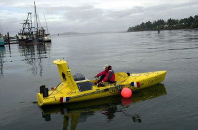 
Emmanuel Coindre, 32, of France, is seen rowing his boat ashore for its removal from the water Tuesday at the boat basin in Charleston, Ore. Coindre, who set out alone from Japan in a rowboat 129 days ago, arrived offshore of Coos Bay, Ore., on Tuesday, and a fishing vessel towed him the last 20 miles to land.
 (Associated Press / The Spokesman-Review)