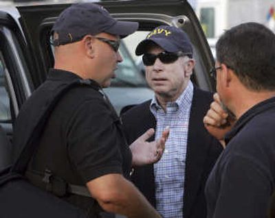 Sen. John McCain, R-Ariz., center, listens to senior campaign adviser Steve Schmidt as Mark Salter looks on after their arrival in Washington last month. Associated Press
 (File Associated Press / The Spokesman-Review)