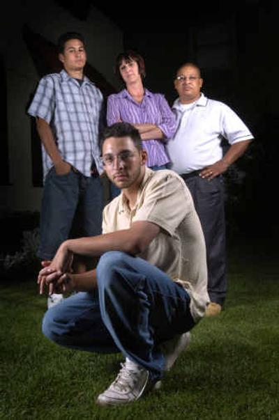 
Jayson Bush's family – brother Micheal, mother M'Liss and father Ray – stood behind him during his eight years in prison. Gov. Gary Locke signed the papers releasing Bush from his 24-year sentence. 
 (Photos by Colin Mulvany/ / The Spokesman-Review)