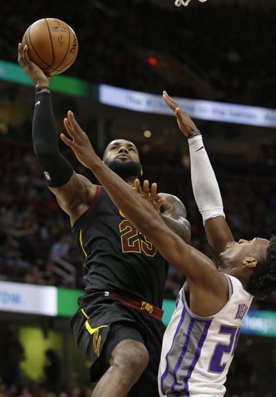 Cleveland Cavaliers’ LeBron James (23) drives to the basket against Sacramento Kings’ Buddy Hield (24), from the Bahamas, in the first half of an NBA basketball game, Wednesday, Dec. 6, 2017, in Cleveland. (Tony Dejak / Associated Press)