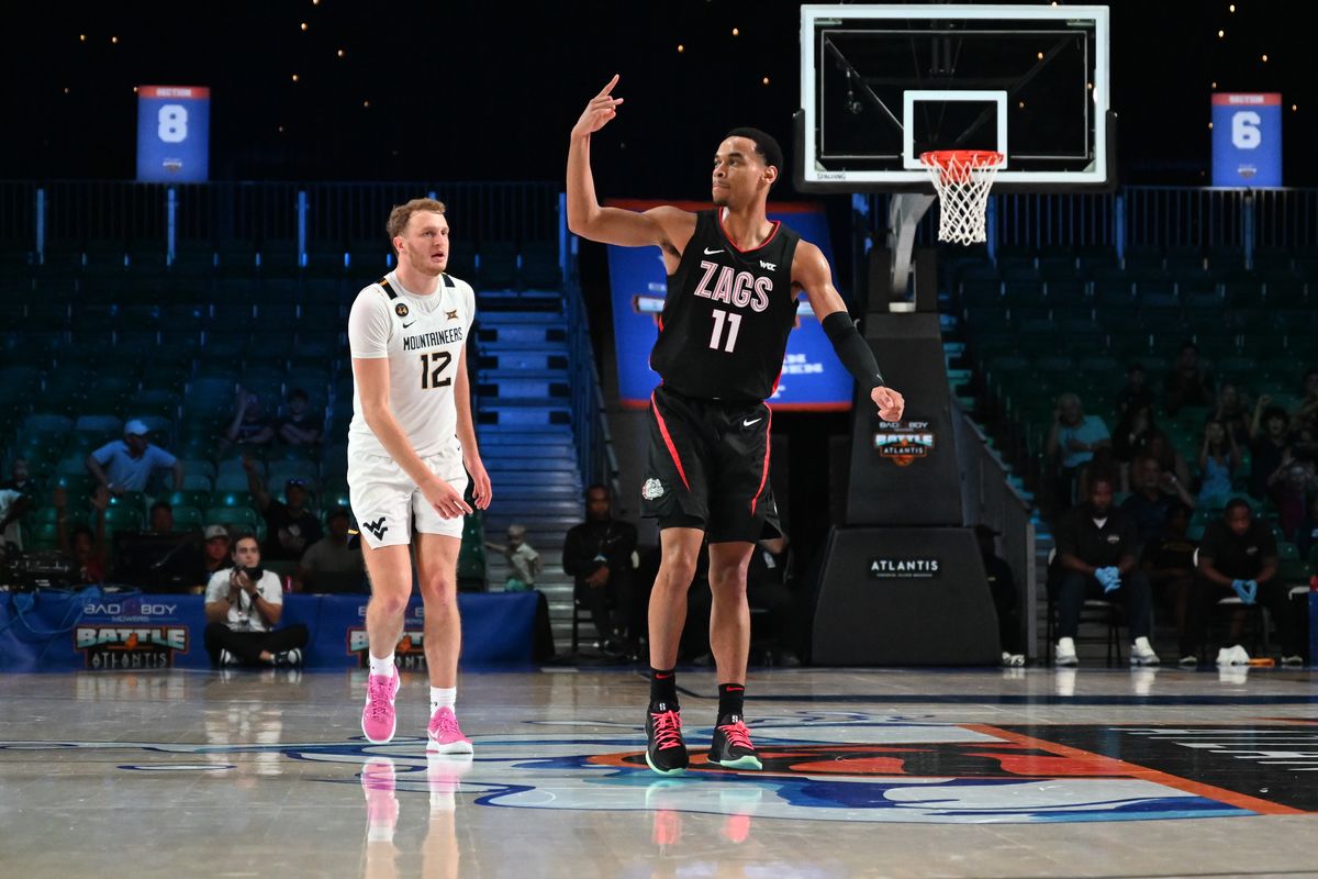 Gonzaga Bulldogs guard Nolan Hickman (11) reacts after scoring against West Virginia Mountaineers guard Tucker DeVries (11) during the first half of a college basketball game on Wednesday, Nov. 27, 2024, on Paradise Island, Bahamas 12), scored. (Tyler Tjomsland/The Spokesman Review)