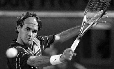 
Switzerland's Roger Federer ties record with victory Saturday. 
 (Associated Press / The Spokesman-Review)