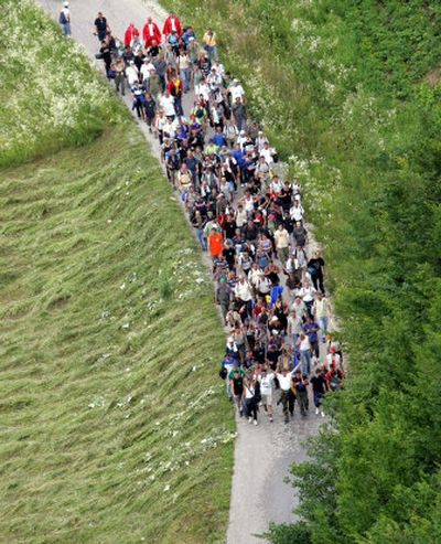 
Marchers fill the road from Zvornik to Srebrenica on Friday.
 (Associated Press photo / The Spokesman-Review)