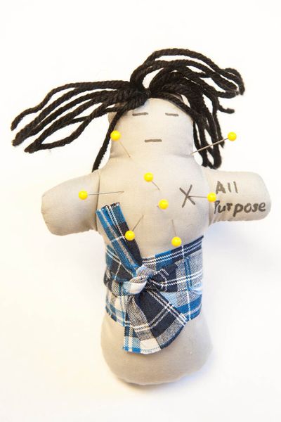 A quick candy bar may stave off more than hunger. It could prevent major fights between husbands and wives, at least if a new study involving voodoo dolls, as pictured here, is right. (Associated Press)