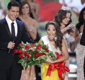 Host Mario Lopez watches Miss Virginia Caressa Cameron react after being crowned Miss America by Katie Stam Miss America 2009, Saturday Jan. 30, 2010 at The Planet Hollywood Resort & Casino in Las Vegas. (Eric Jamison / Fr156391 Ap)