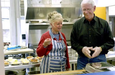 
Barbara Furcron, left and Norm Ridge share a laugh after serving food at St.Thomas Catholic Church soup kitchen in April. The two coordinate, direct and organize the free meals at the church in Coeur d'Alene every Tuesday. 
 (Kathy Plonka / The Spokesman-Review)