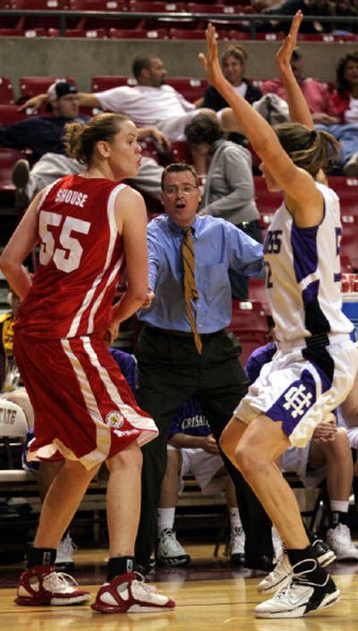 
Holy Cross head coach Bill Gibbons watches as his player, Kaitlin Foley, right, defends Sarah Shouse of Western Kentucky at the Wells Fargo Holiday Classic earlier this month. 
 (Associated Press / The Spokesman-Review)