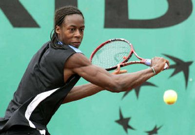 
France's Gael Monfils returns the ball while playing a second-round match against Belgium's Dick Norman. 
 (Associated Press / The Spokesman-Review)