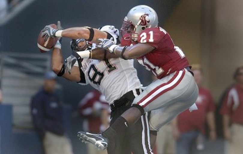 WSU defensive back #21 Chima Nwachukwu gets just enough of the pass to knock it away from San Diege State tight end #81 Steve Schmidt in the endzone Saturday September 8, 2007  at QWest Field in Seattle.  CHRISTOPHER ANDERSON The Spokesman-Review (Christopher Anderson / The Spokesman-Review)