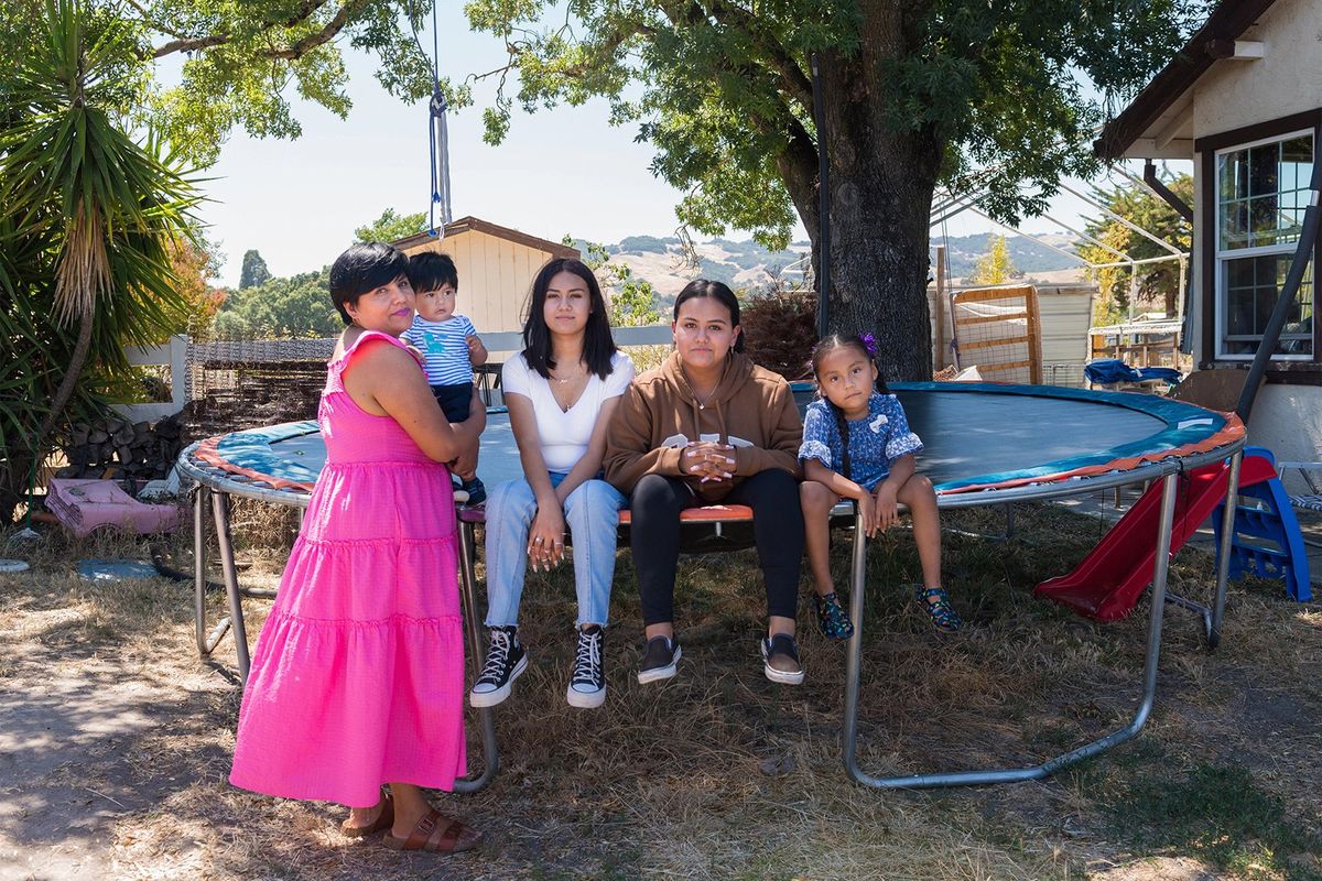 The Bravo family, from left, mom Erandy, Vicente, Maia, Mia and Erandy, sit outside their home in August in Sonoma, Calif.  (Heidi De Marco/KHN/TNS)