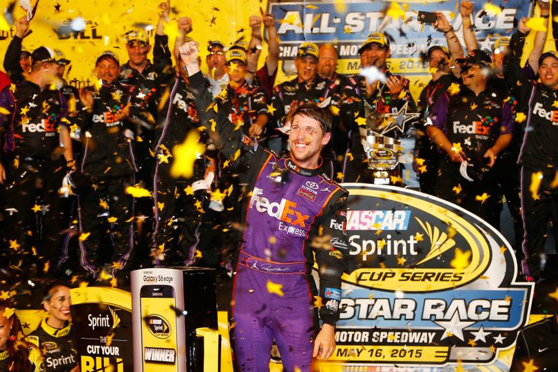 Denny Hamlin, driver of the #11 FedEx Express Toyota, celebrates in victory lane after winning the NASCAR Sprint Cup Series Sprint All-Star Race at Charlotte Motor Speedway on May 16, 2015 in Charlotte, North Carolina. (Photo Credit: Jerry Markland/Getty Images)