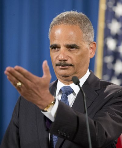 Attorney General Eric Holder gestures during a news conference at the Justice Department on Thursday. (Associated Press)