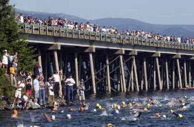 
While family and friends watch, hundreds of swimmers start the Long Bridge Swim, an annual race from the south end to Dog Beach in Sandpoint, through Lake Pend Oreille Saturday.
 (Jesse Tinsley / The Spokesman-Review)