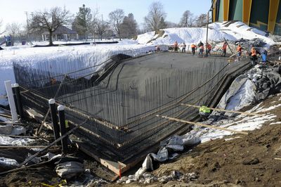 The pool at Shadle Park takes shape as crews pour concrete to create the floor. The project was among those made possible by a voter-approved $42.9 million bond  (Dan Pelle / The Spokesman-Review)