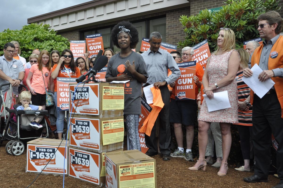 OLYMPIA – Ola Jackson, a Rainier Beach High School student, addresses other volunteers for the Initiative 1639 campaign before turning in signatures for the gun control ballot measure on July 6. (Jim Camden / The Spokesman-Review)