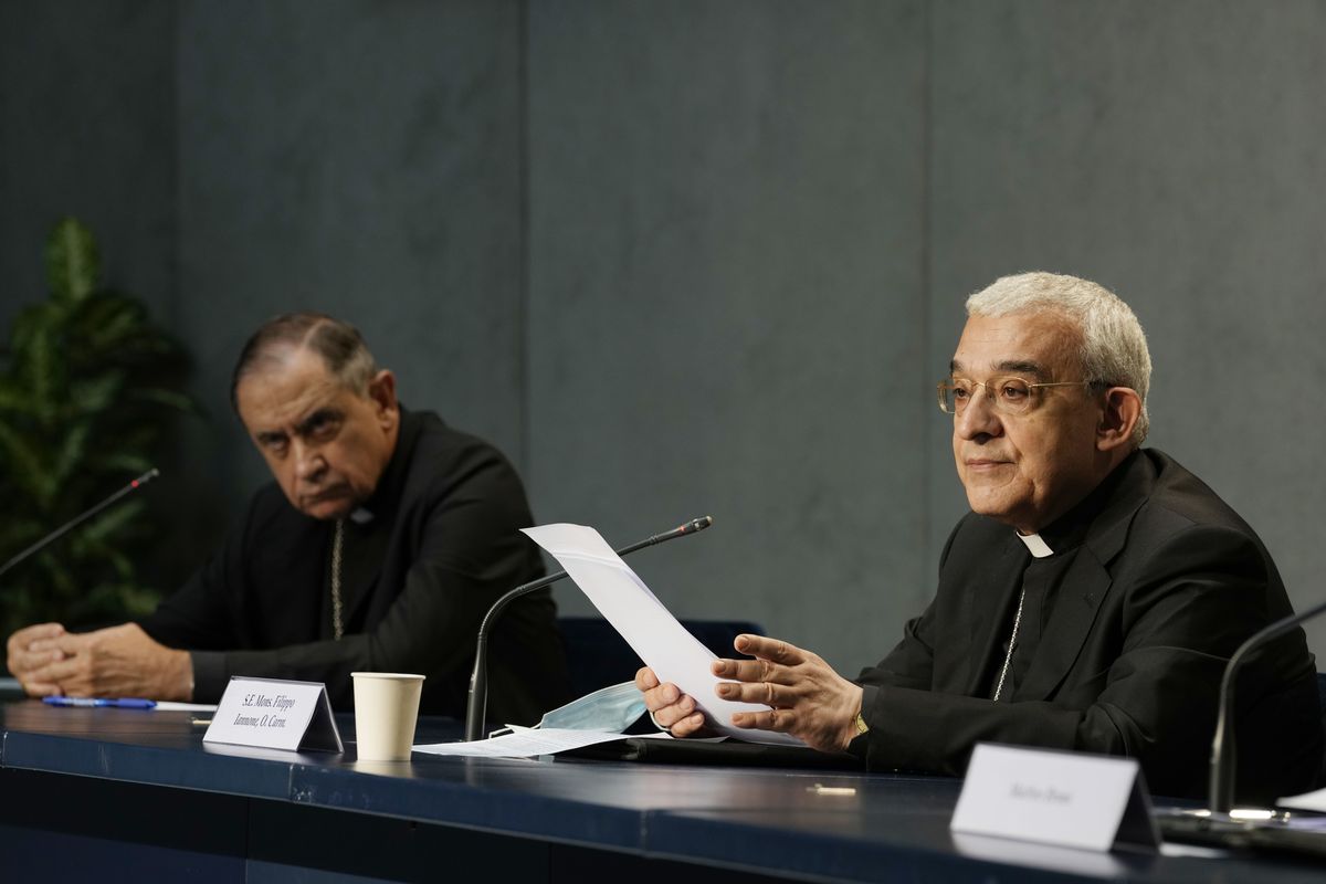 Mons. Filippo Iannone, right, and Mons. Juan Ignacio Arrieta Ochoa de Chinchetru hold a press conference to illustrate changes in the Church